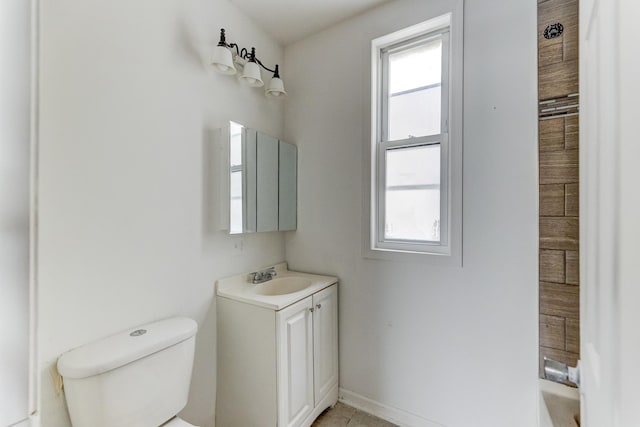 6601 S St Lawrence Ave, Chicago, IL 60637 - full bathroom with toilet, vanity, tile patterned floors, and a tub to relax in
