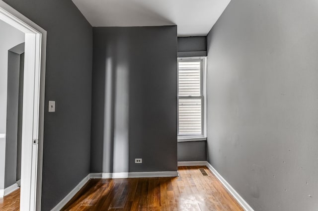 6601 S St Lawrence Ave, Chicago, IL 60637 - unfurnished room featuring wood finished floors and baseboards
