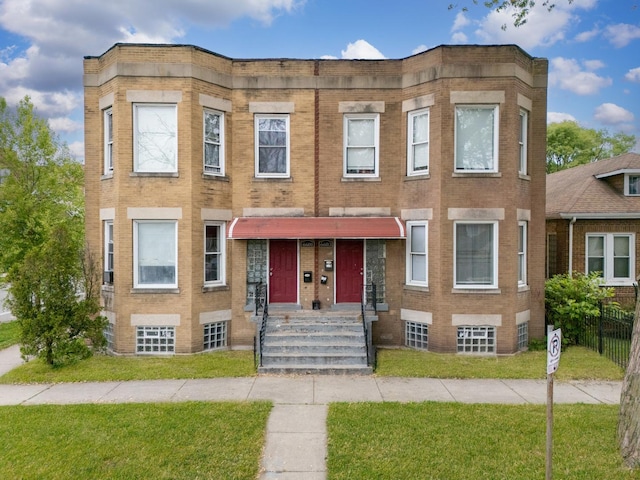 6601 S St Lawrence Ave, Chicago, IL 60637 - view of front of home featuring a front lawn and brick siding