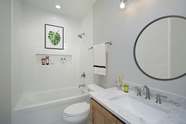 bathroom featuring toilet, shower / tub combination, and vanity
