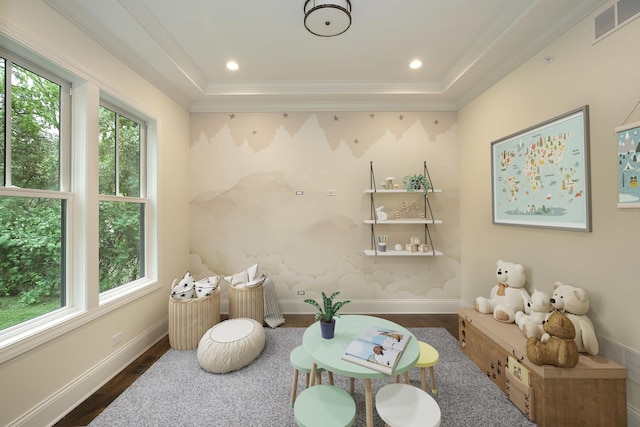 sitting room featuring visible vents, wood finished floors, and a wealth of natural light