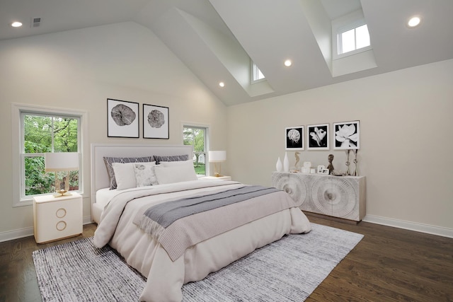 bedroom featuring baseboards, high vaulted ceiling, multiple windows, and a skylight