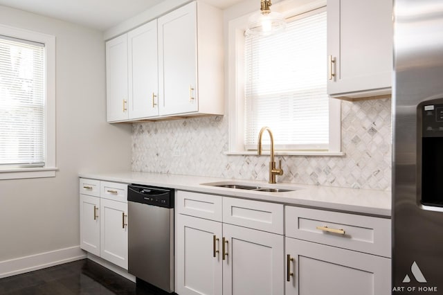 kitchen featuring a sink, white cabinetry, appliances with stainless steel finishes, and light countertops