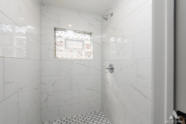 full bath featuring tiled shower