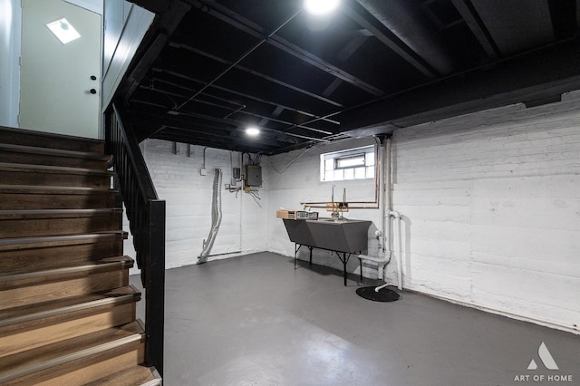 below grade area featuring stairs and electric panel