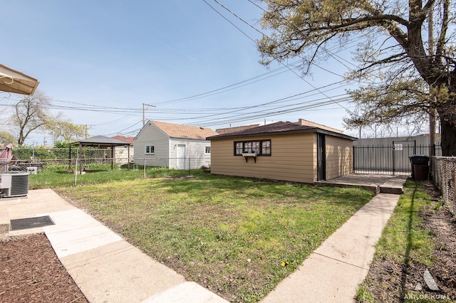 exterior space with a gazebo, a fenced backyard, and cooling unit
