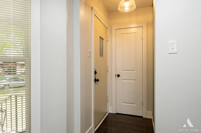 corridor with dark wood finished floors