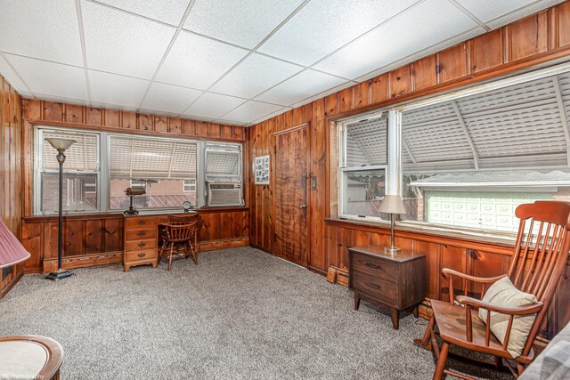office featuring carpet, wood walls, and cooling unit