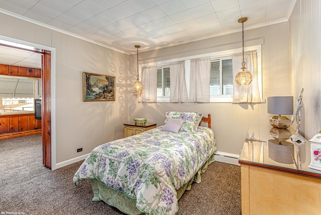 carpeted bedroom featuring a baseboard radiator, ornamental molding, and multiple windows