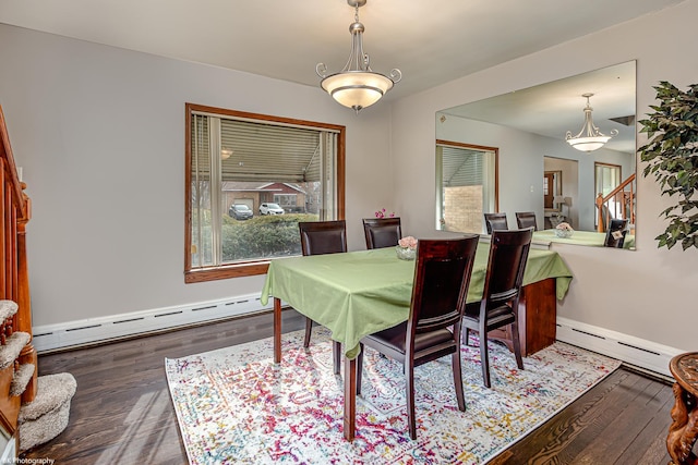 dining area with baseboards, wood finished floors, and baseboard heating