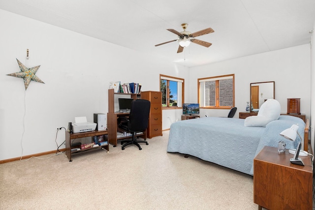 bedroom with baseboards, a ceiling fan, and carpet