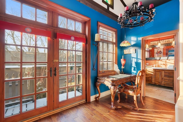 3842 N Alta Vista Ter, Chicago, IL 60613 - dining room with a chandelier, wood-type flooring, french doors, and baseboards