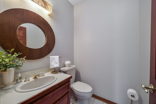 half bath featuring tile patterned flooring, toilet, and vanity