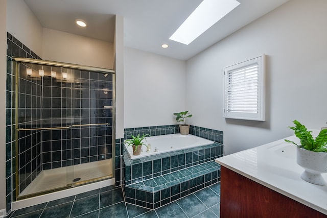 bathroom with tile patterned floors, recessed lighting, a shower stall, a tub with jets, and a skylight