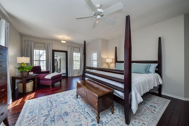 bedroom with baseboards and wood finished floors