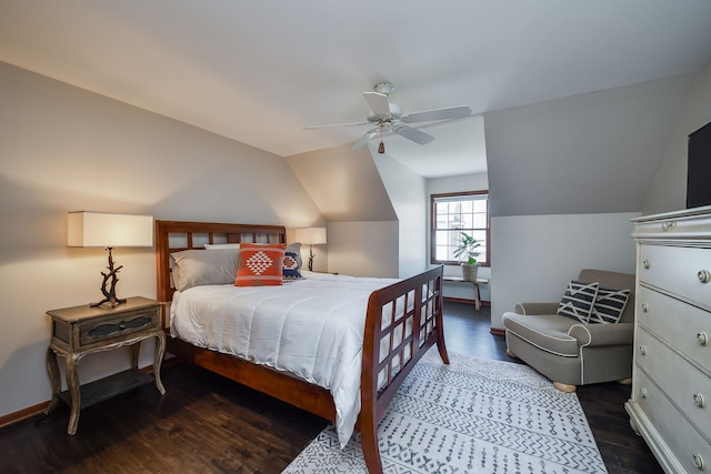 bedroom with a ceiling fan, baseboards, wood finished floors, and lofted ceiling