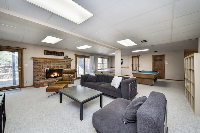 carpeted living area featuring visible vents, billiards, a paneled ceiling, and a brick fireplace