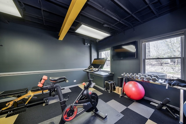 exercise room with baseboards