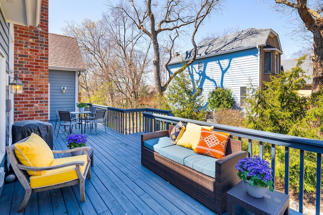 wooden terrace with outdoor lounge area and outdoor dining area