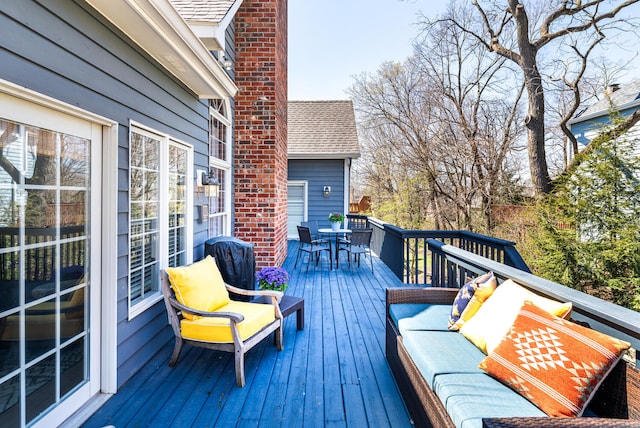 deck featuring an outdoor hangout area and outdoor dining space