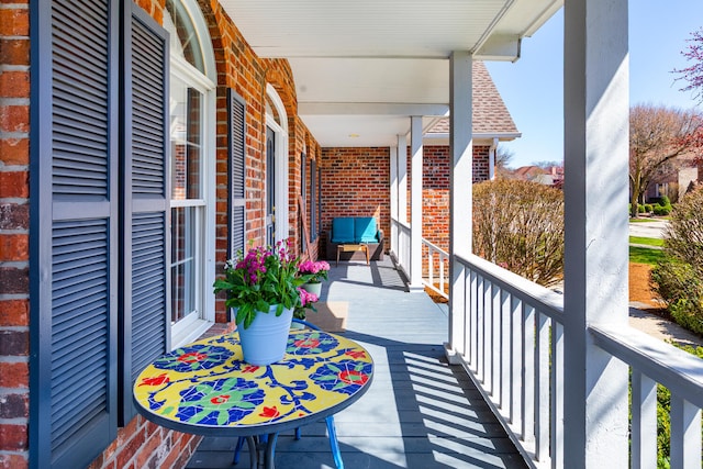 balcony featuring a porch