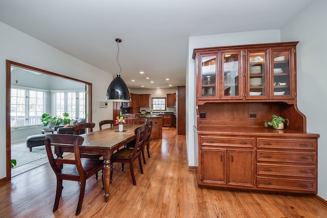 dining area featuring recessed lighting and light wood finished floors
