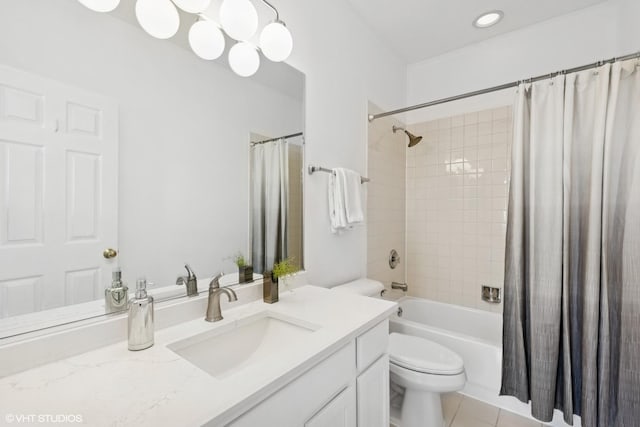 full bath with vanity, tile patterned floors, shower / bath combo with shower curtain, and toilet