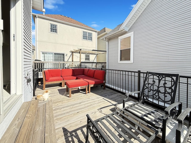 wooden deck featuring outdoor lounge area