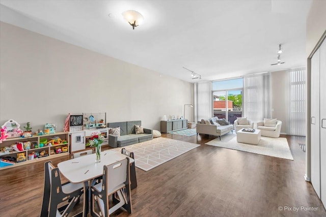 324 N Jefferson St Unit 307, Chicago, IL 60661 - dining room featuring rail lighting, wood finished floors, and expansive windows