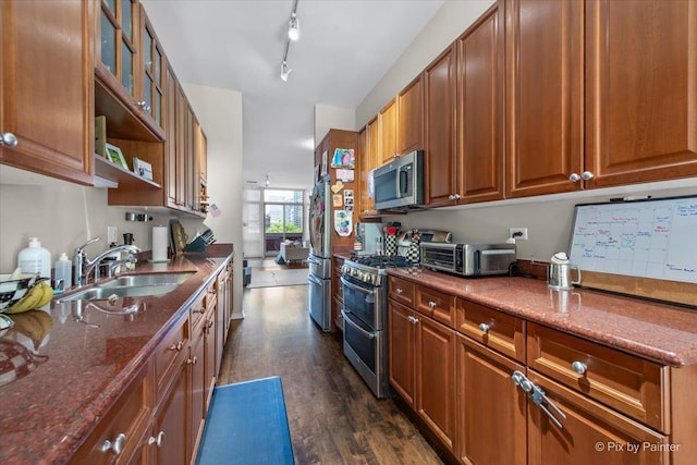 324 N Jefferson St Unit 307, Chicago, IL 60661 - kitchen with stainless steel appliances, a sink, dark wood-style floors, and brown cabinets