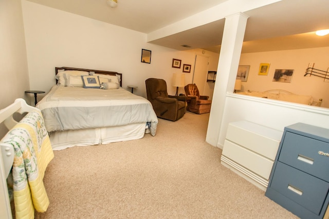 bedroom featuring light carpet