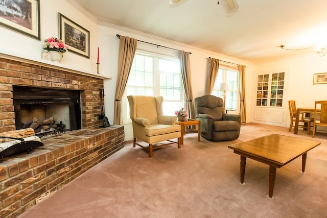carpeted living area featuring crown molding, ceiling fan, and a brick fireplace