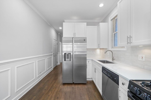 2515 W Harrison St Unit 1, Chicago, IL 60612 - kitchen with crown molding, appliances with stainless steel finishes, a sink, light countertops, and white cabinets