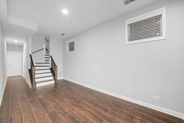 2515 W Harrison St Unit 1, Chicago, IL 60612 - basement with baseboards, recessed lighting, dark wood-style floors, and stairway