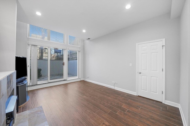 2515 W Harrison St Unit 1, Chicago, IL 60612 - unfurnished living room featuring baseboards, recessed lighting, and wood finished floors