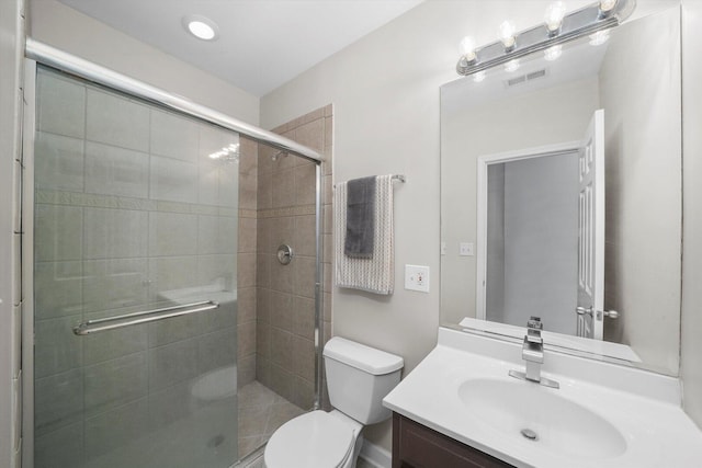 2515 W Harrison St Unit 1, Chicago, IL 60612 - bathroom featuring toilet, visible vents, a shower stall, and vanity