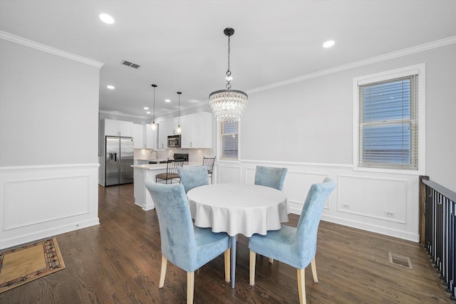 2515 W Harrison St Unit 1, Chicago, IL 60612 - dining space featuring crown molding, recessed lighting, a chandelier, and visible vents