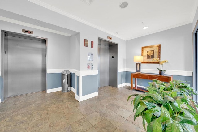 interior space featuring stone tile floors, elevator, ornamental molding, and baseboards