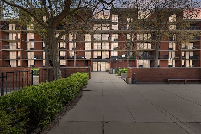 view of building exterior with fence
