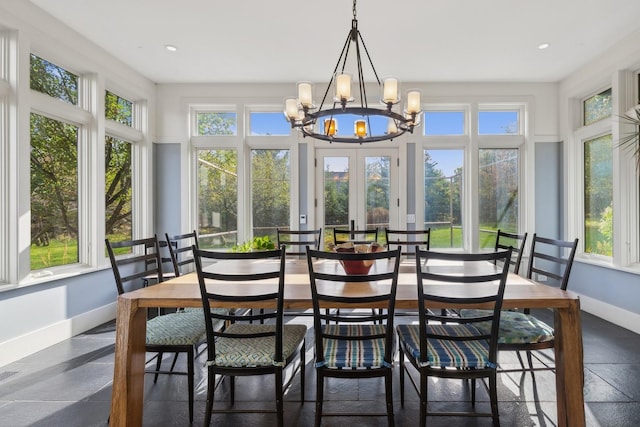 sunroom / solarium with baseboards, french doors, recessed lighting, and a notable chandelier