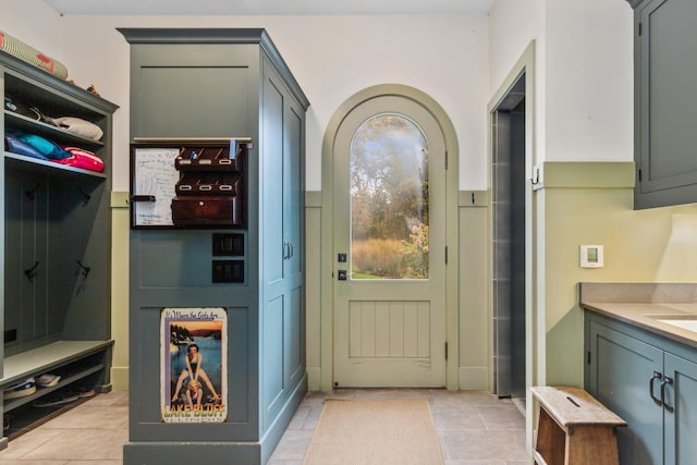 mudroom with light tile patterned floors