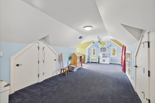 bonus room featuring carpet flooring, visible vents, and lofted ceiling