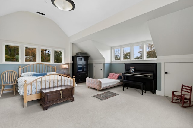 carpeted bedroom featuring lofted ceiling
