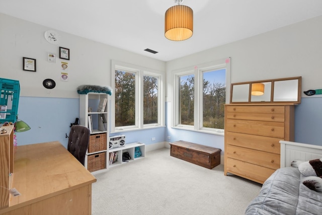 bedroom with carpet floors and visible vents