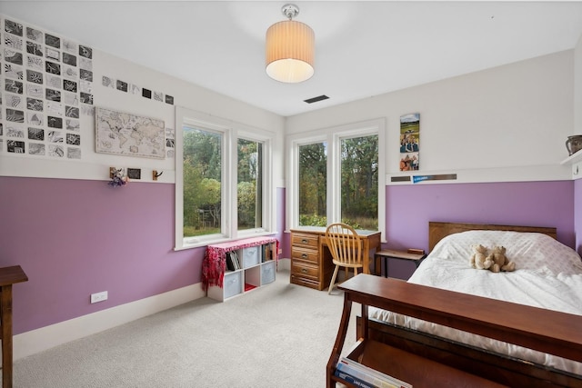 carpeted bedroom with baseboards and visible vents