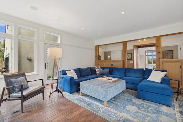 living area with recessed lighting and hardwood / wood-style floors