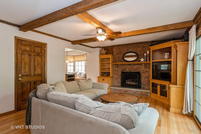 6S475 Sussex Rd, Naperville, IL 60540 - living room with light wood-style floors, beam ceiling, a ceiling fan, and a fireplace
