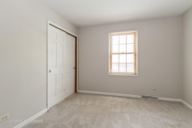 6S475 Sussex Rd, Naperville, IL 60540 - unfurnished bedroom featuring light carpet and a closet