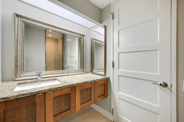 full bathroom featuring vanity and a stall shower