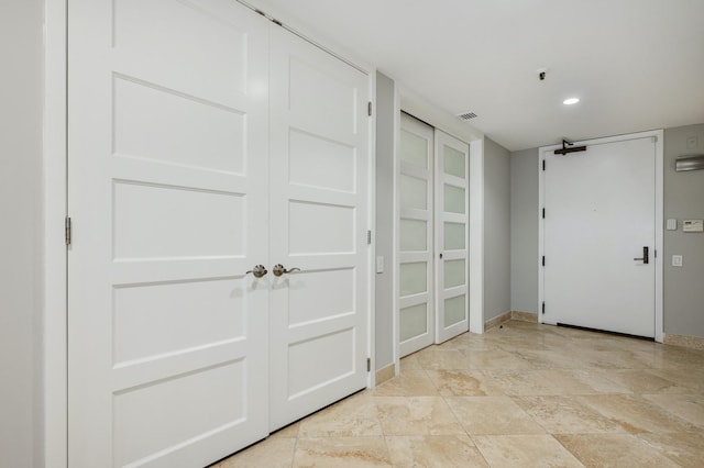 interior space with baseboards and visible vents